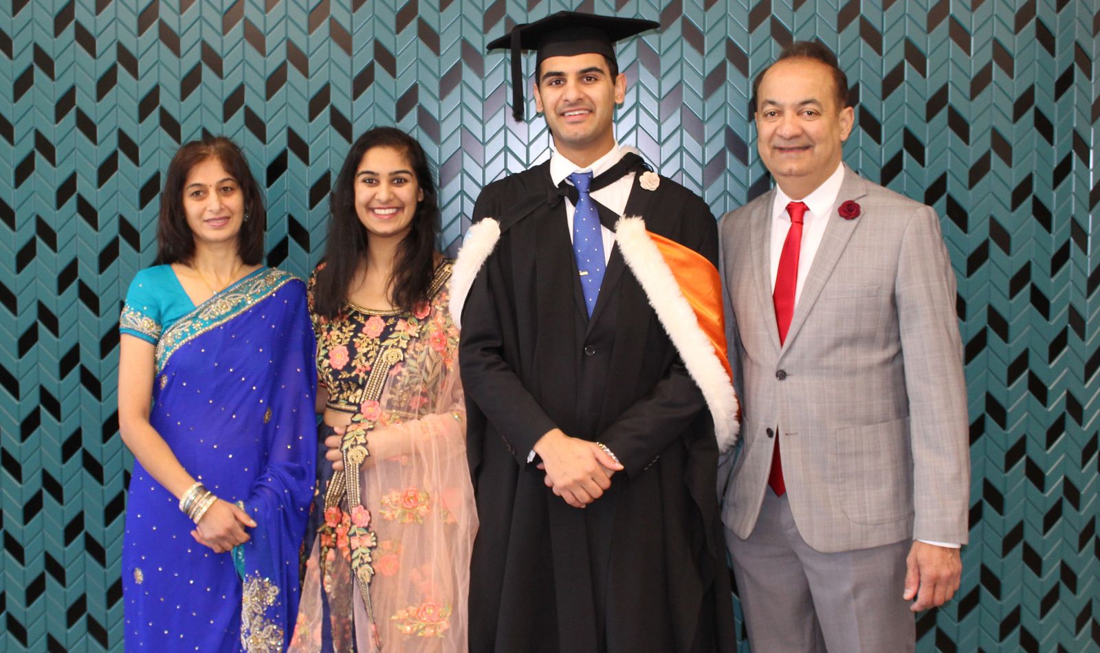 Bhavin celebrates graduation with his mother Nikita Parshottam (left), his sister Pooja Parshottam (second left), and his father Nitin Parshottam (right).