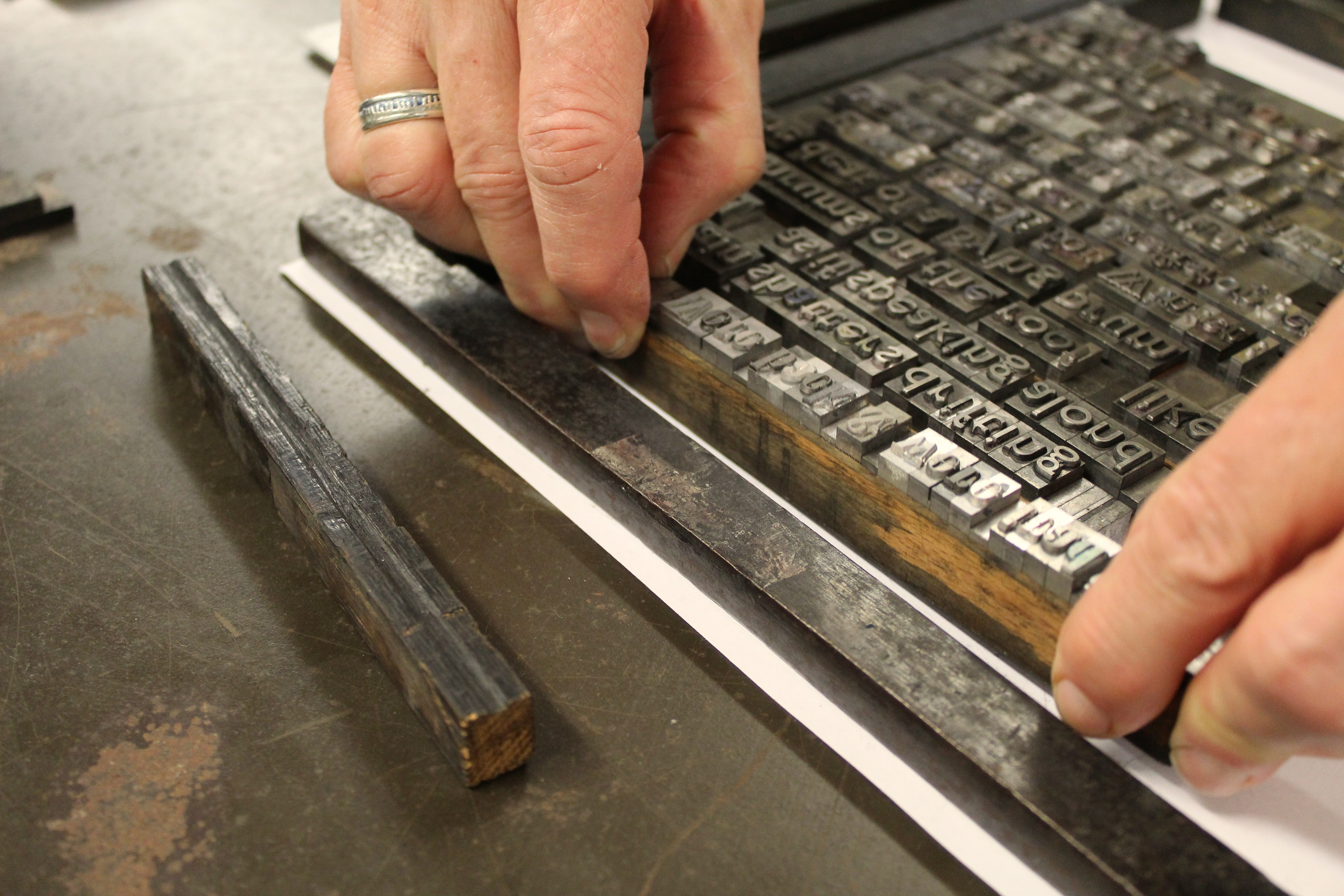 a pair of hands sets metal type