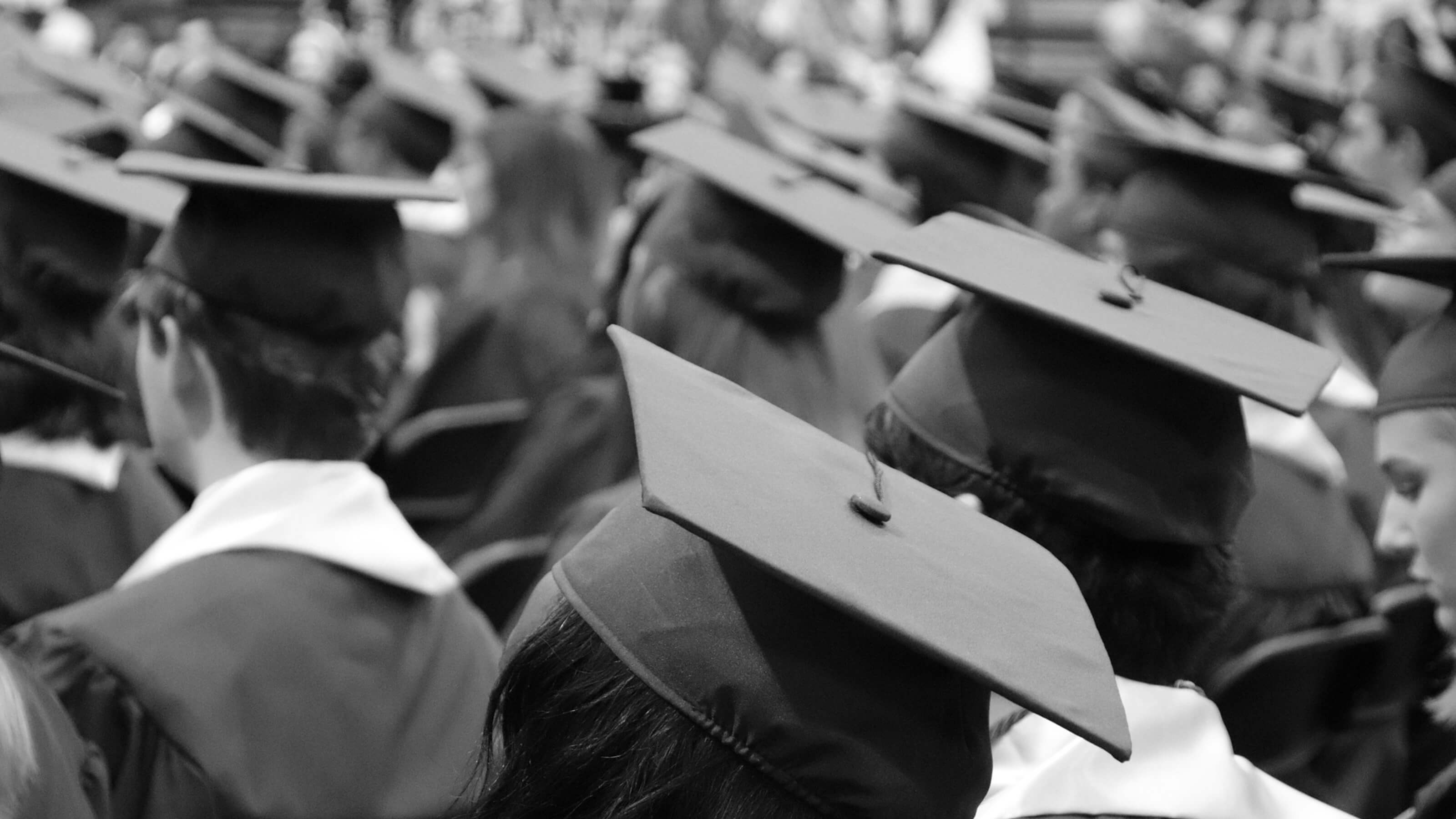 Black and white image of students graduating.