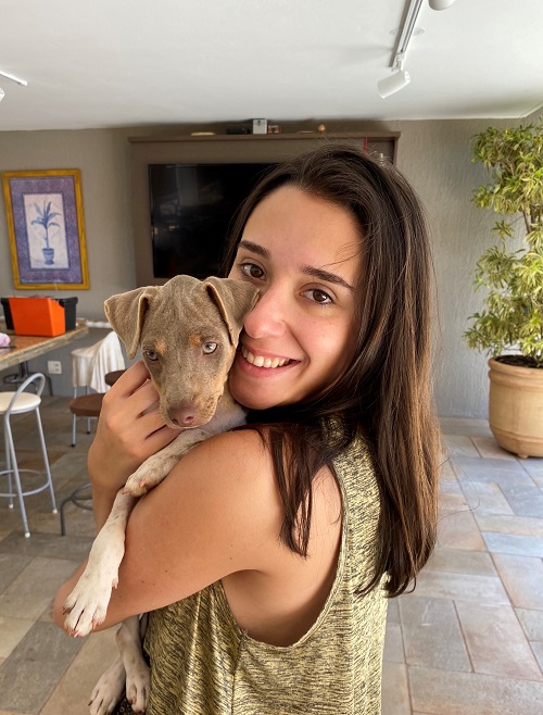 Photo of Luisa Bucci holding a puppy