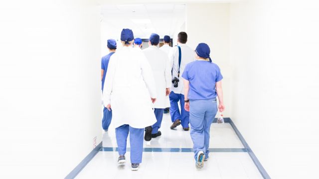 Medical professionals walking down a corridor