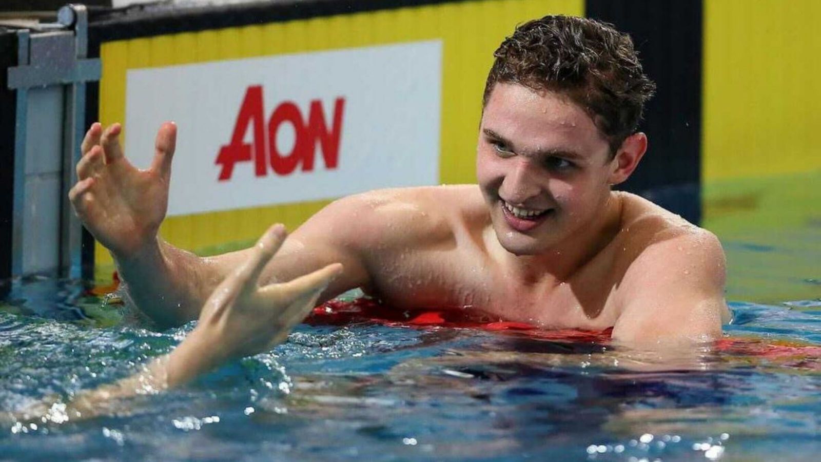 swimmer in water with smile on face