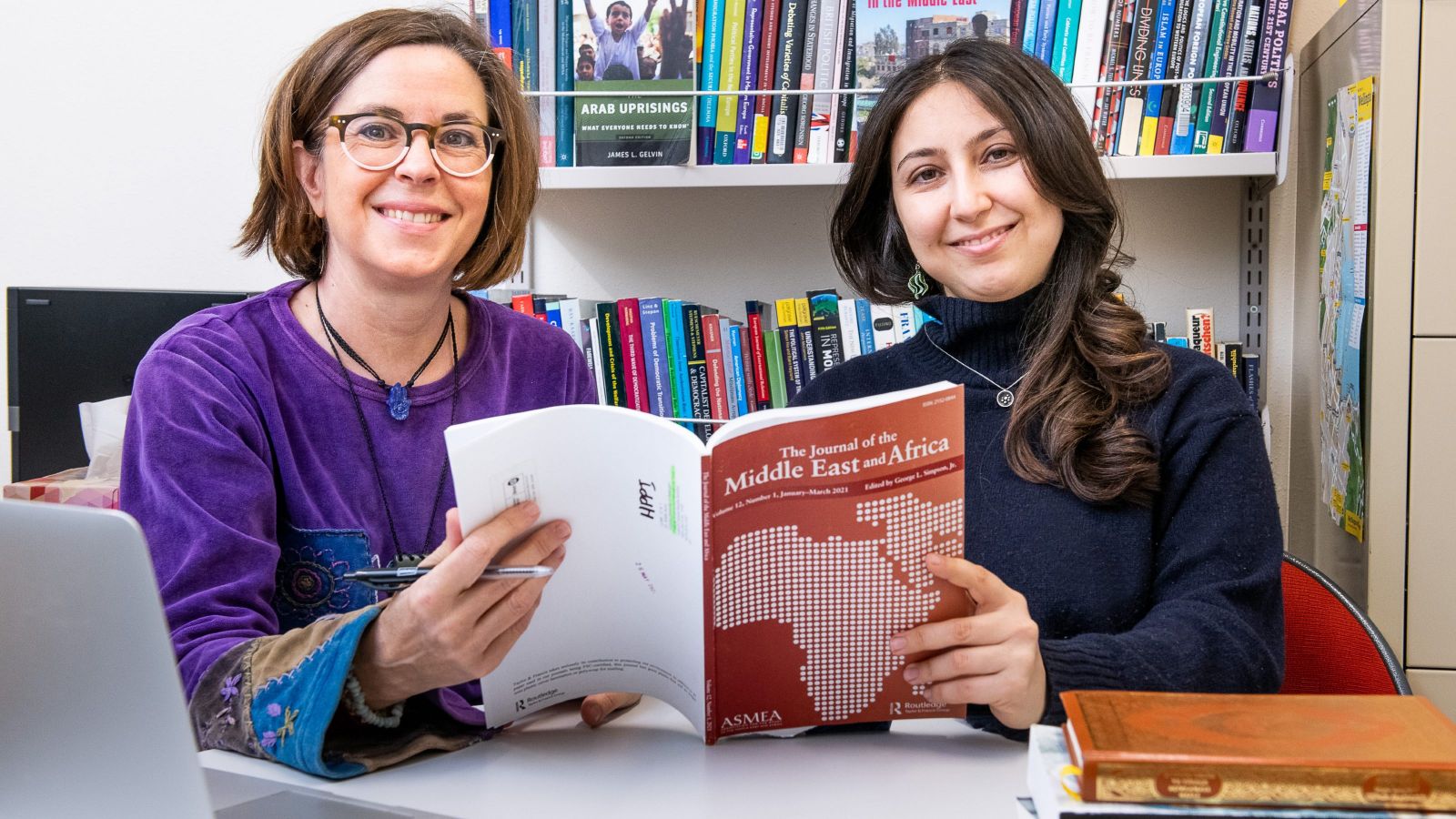Dr Hanlie Booysen and Dr Ayca Arkilic with 'The  Journal of the Middle East and Africa' in hand. 