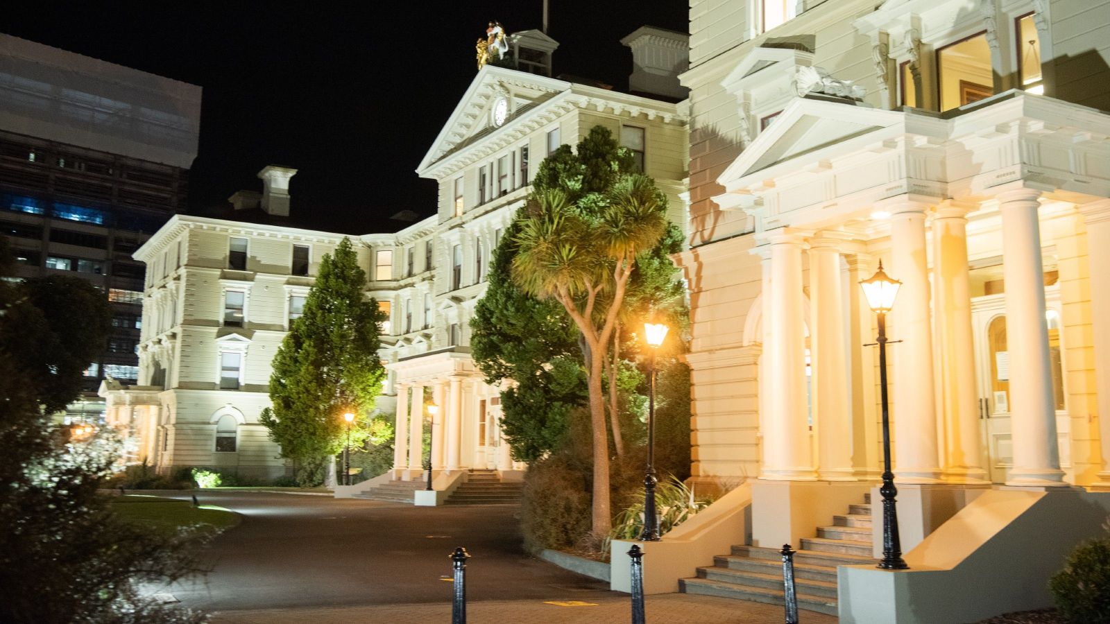 Image of the faculty from the right at night with lights on