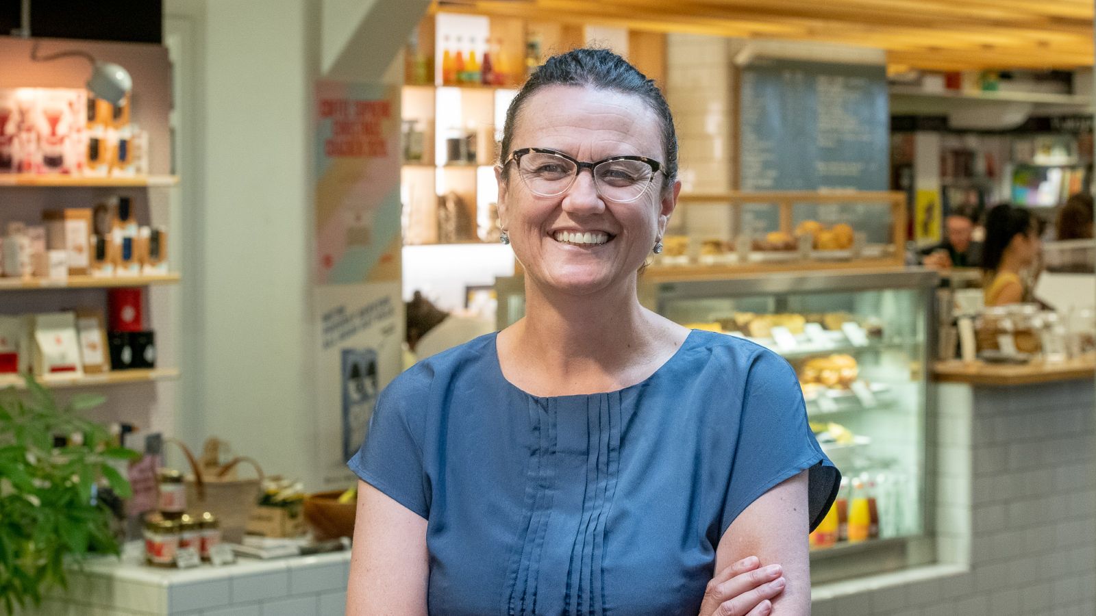 Woman standing in a cafe