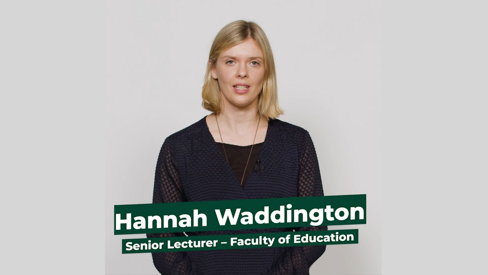Senior Lecturer Hannah Waddington stands facing the camera against a white background