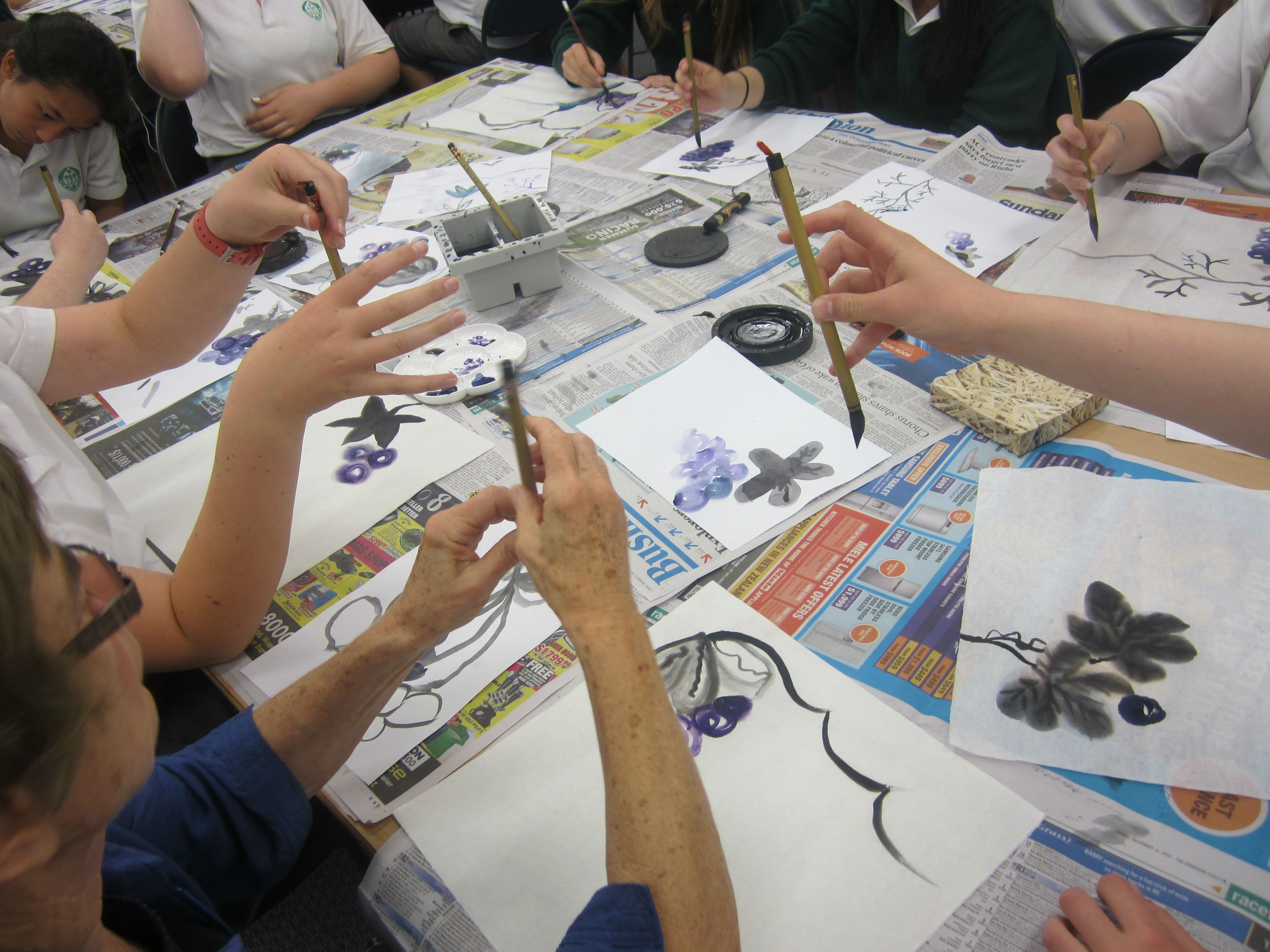 Wanganui High School's students learning to hold the paint brush before painting