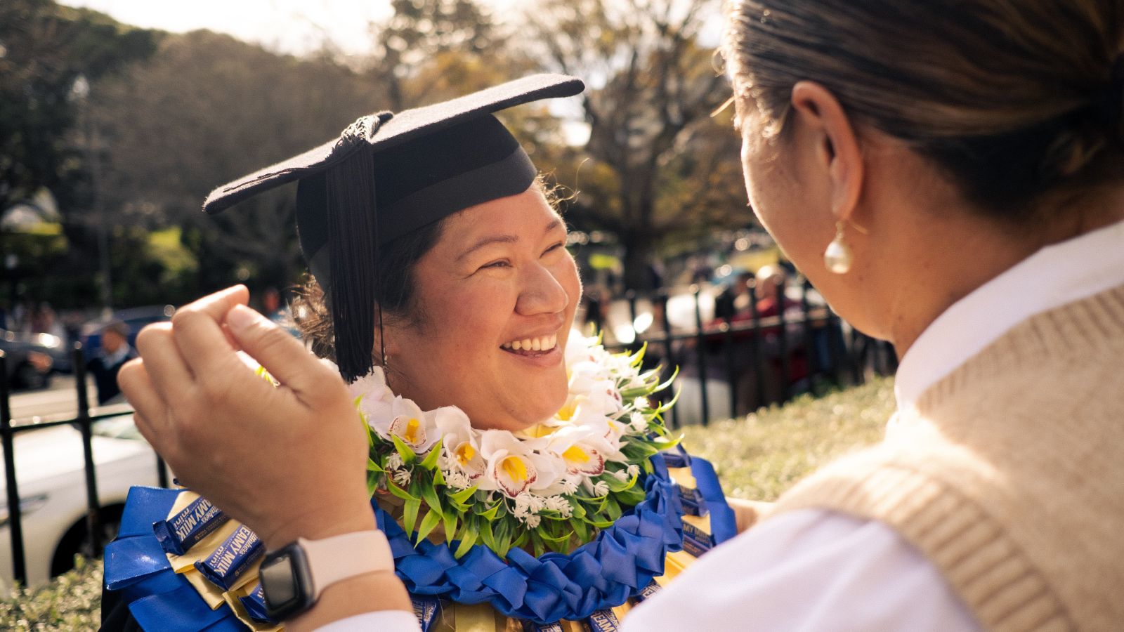 Post Graduate Student Melemo, sharing the special moment of graduating with family 