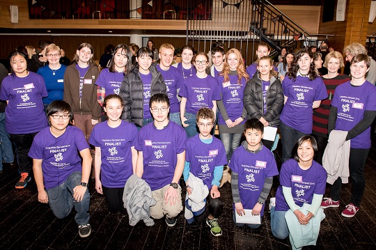 Group of students in purple t-shirts with teachers - Linguistics Olympiad finalists