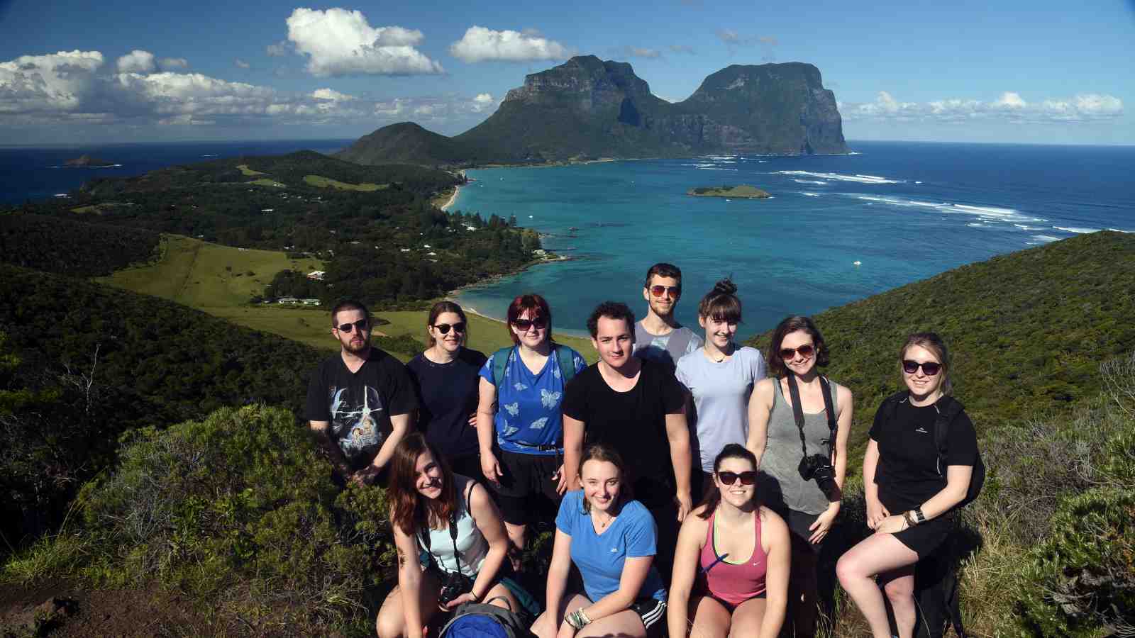 Students at the top of Malabar hill looking across the island towards Mt. Gower