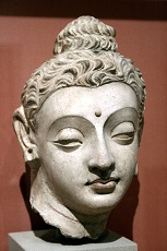 Stone carving of head of Buddha