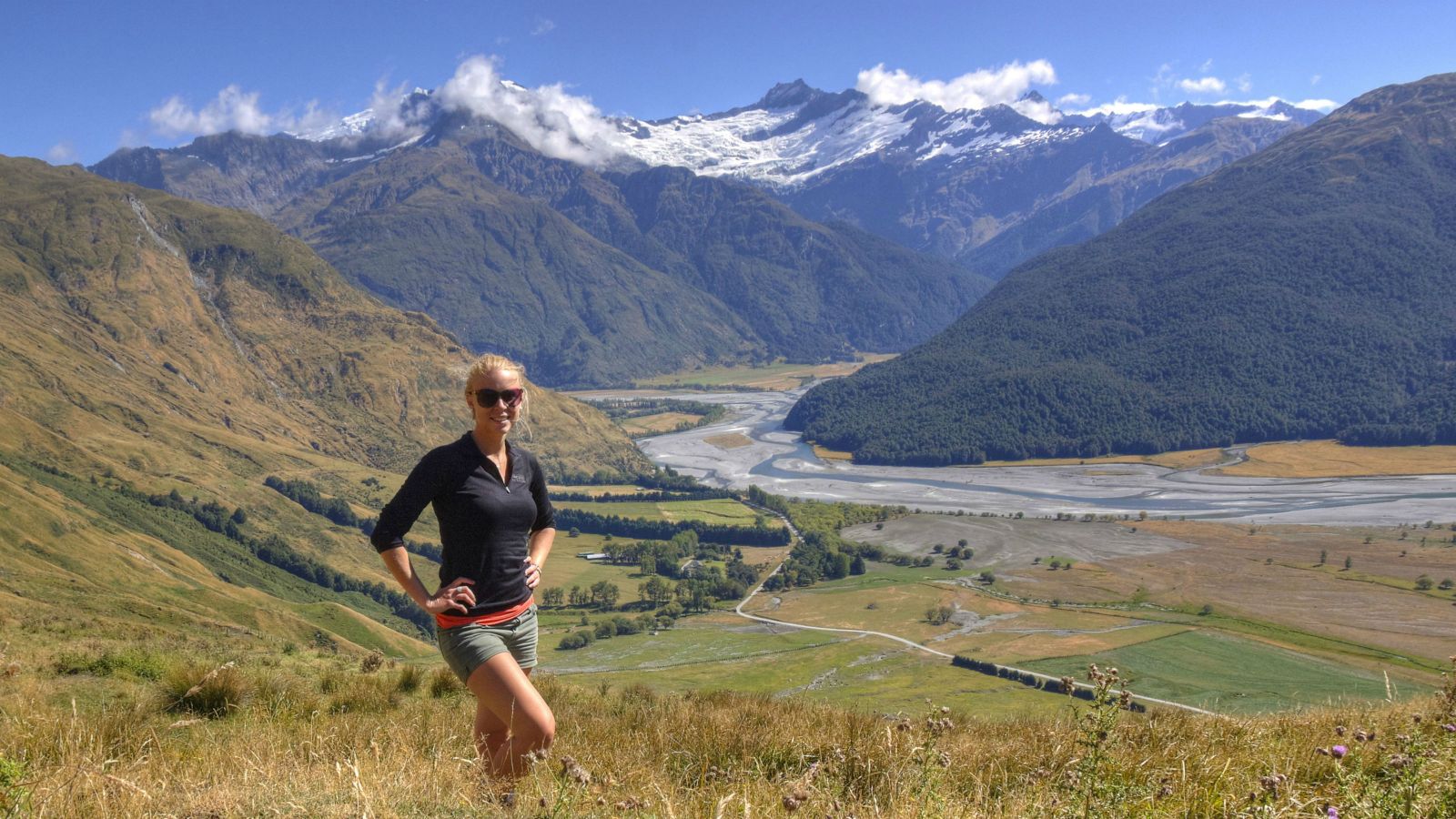 Emily Warren-Smith stands above the Matukituki River in the Southern Alps