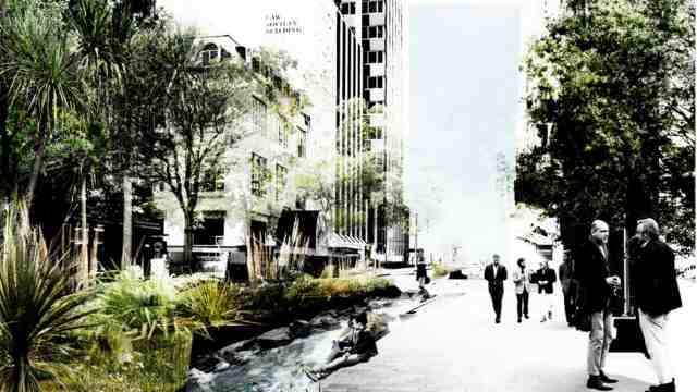 Buildings in central Wellington with a stream running along in front of them.