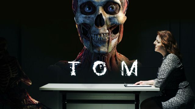 Skeletal face peers out on the move poster for film, Tom.
