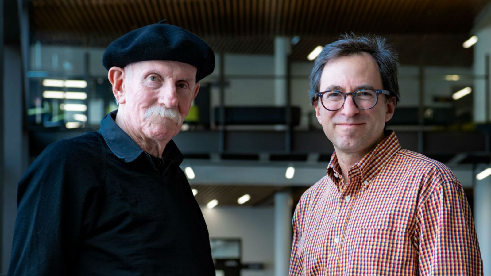 Professor Paul Atkinson and Dr Andrew Munkacsi stand side-by-side, looking at the camera. 