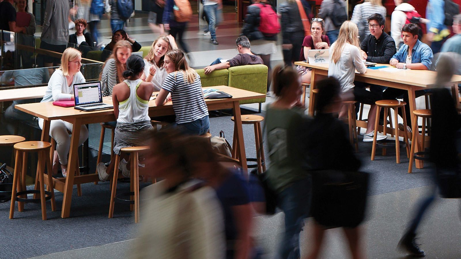 Blurred image of pedestrians in the Hub at Kelburn campus.