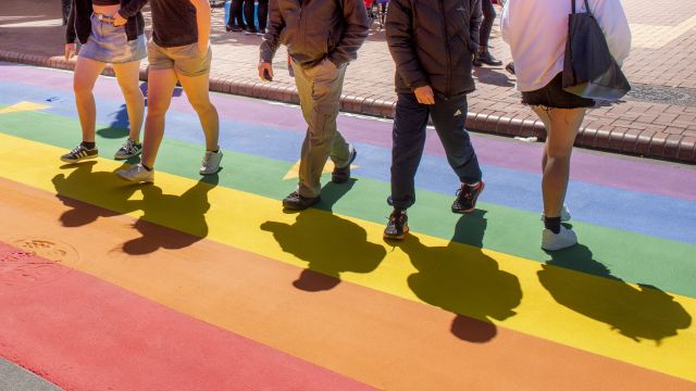 Students walking across Rainbow crossing on Cuba Street
