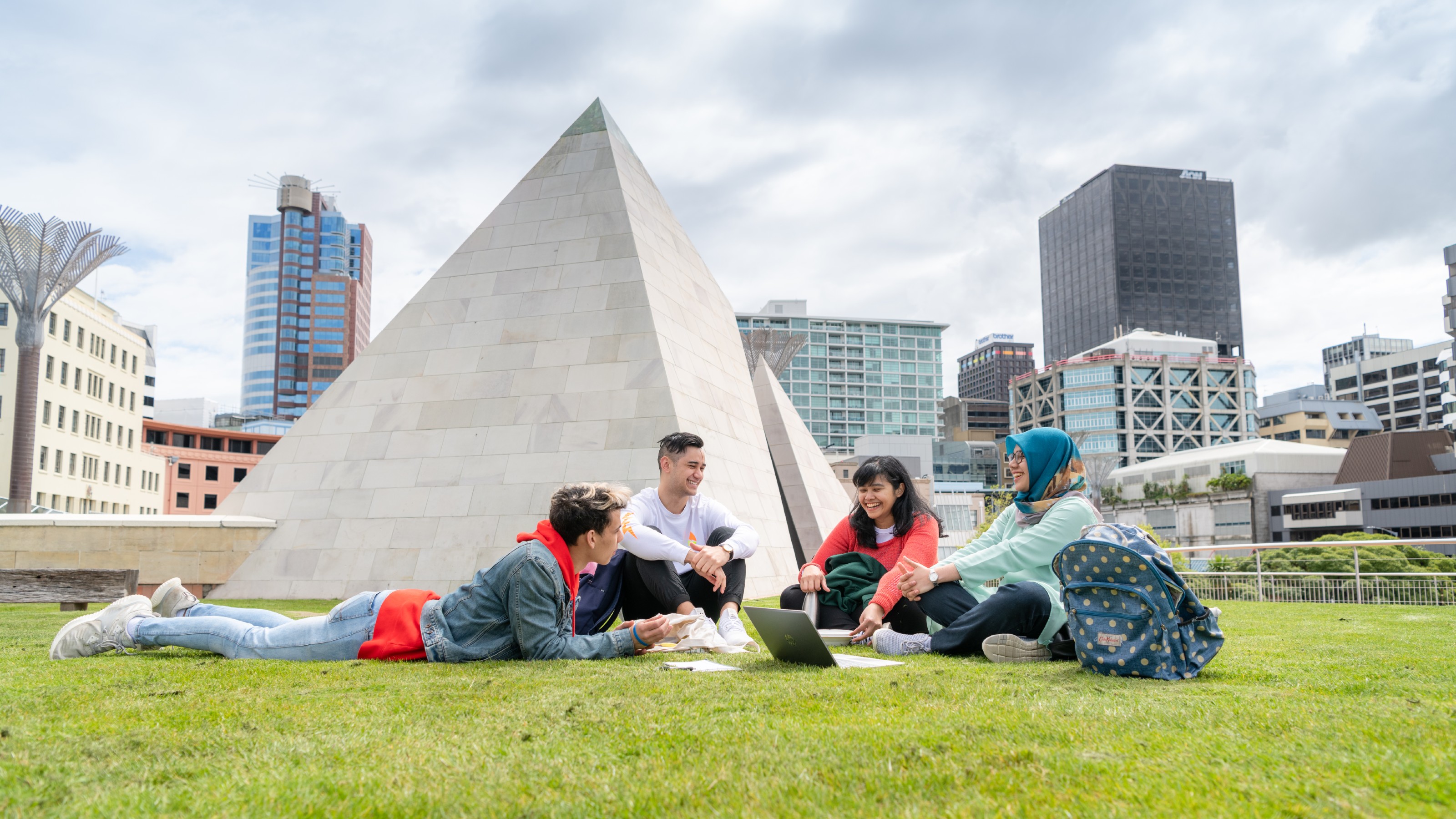 Four students studying together by the Civic Square