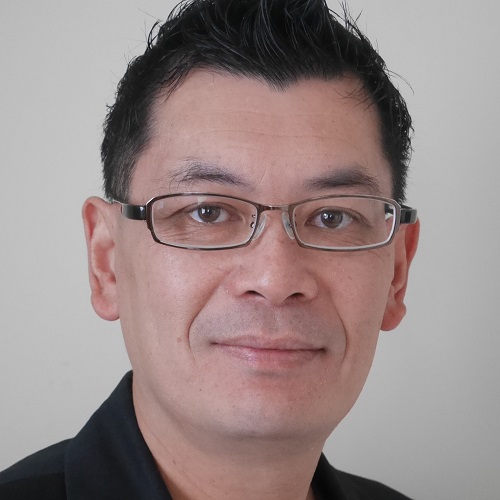 Head and shoulders portrait of Dr Shen Chong
