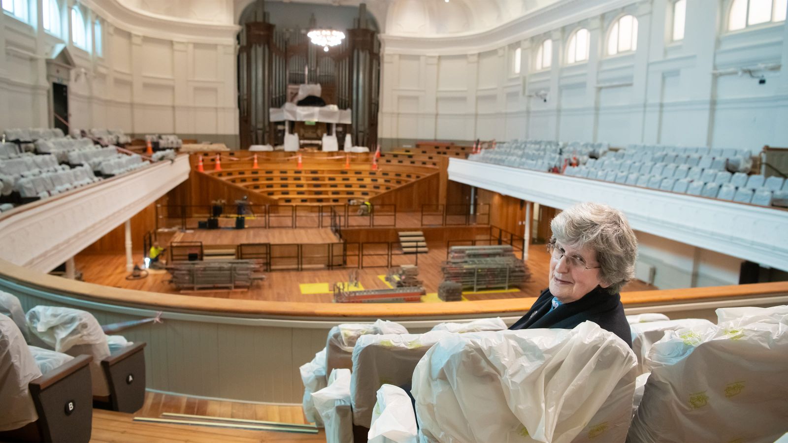 Sylvia Findlay sitting in the Adam Auditorium of Wellington Town Hall