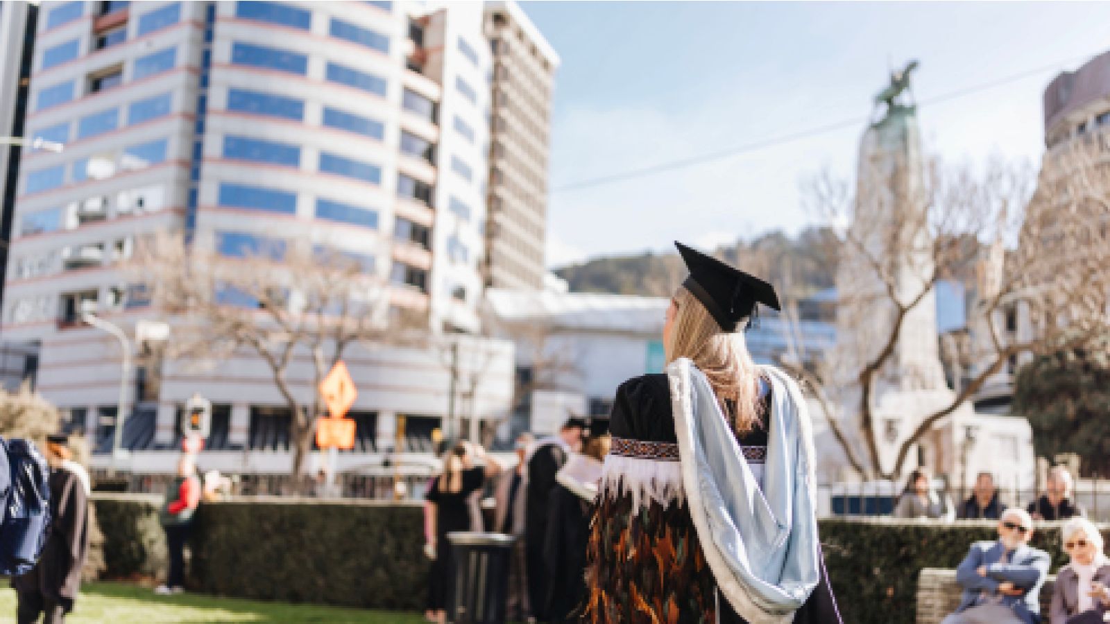 Image of a graduate parading in a Māori cloak