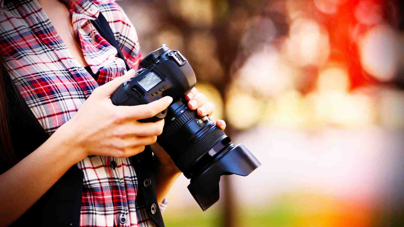 Photographer holding camera