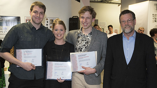 Students from the 2014 exhibition pose for a photograph with their certificates.