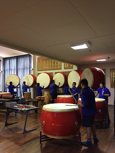 students are playing drums