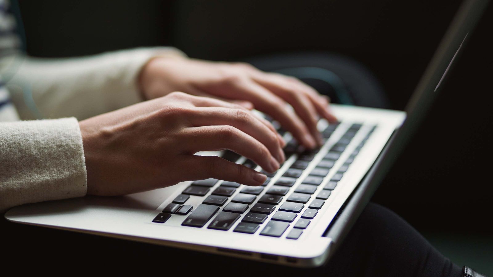 Person typing on a laptop