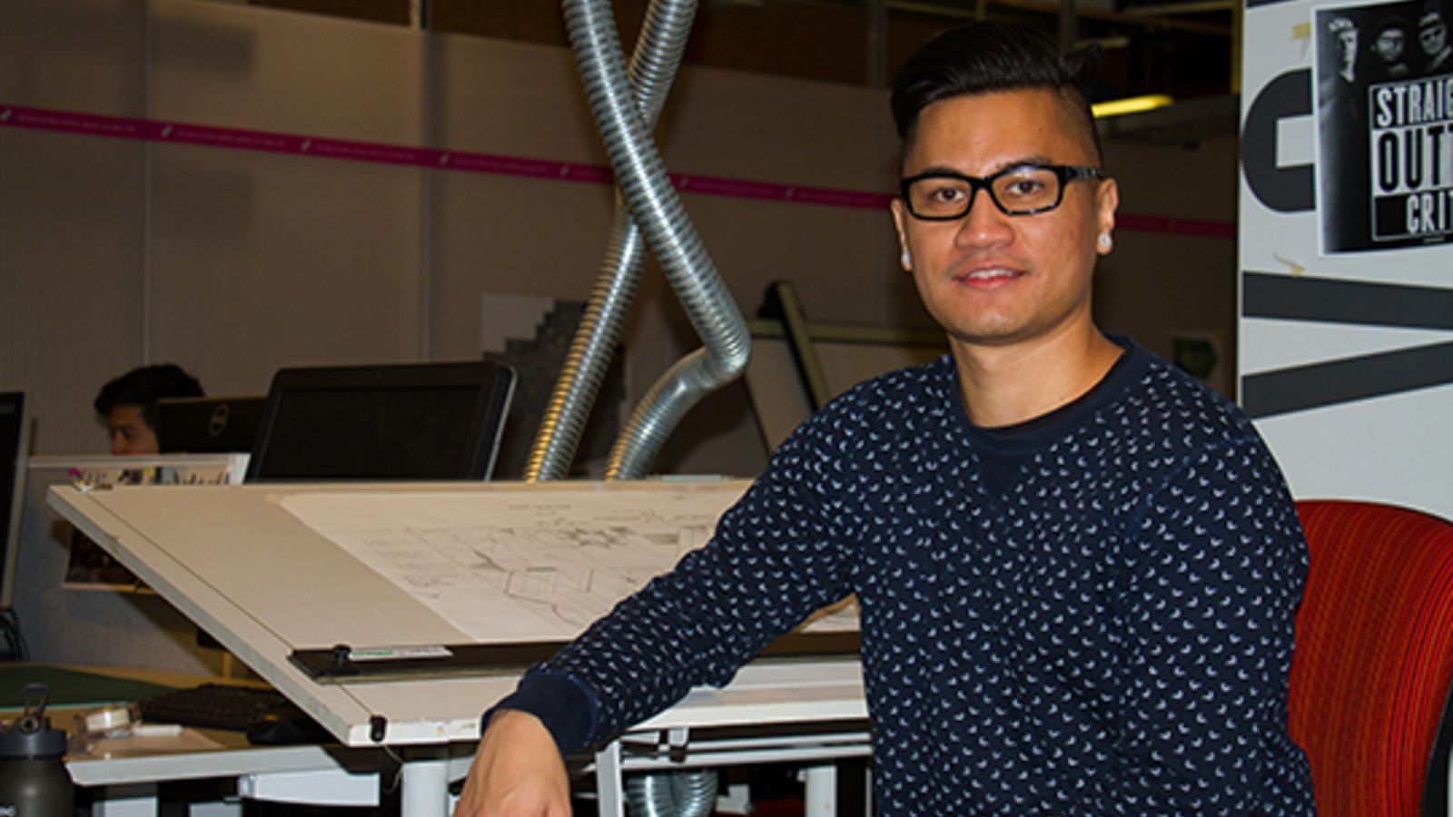 Jeff Bartlett, architecture Awhina student, at his desk.