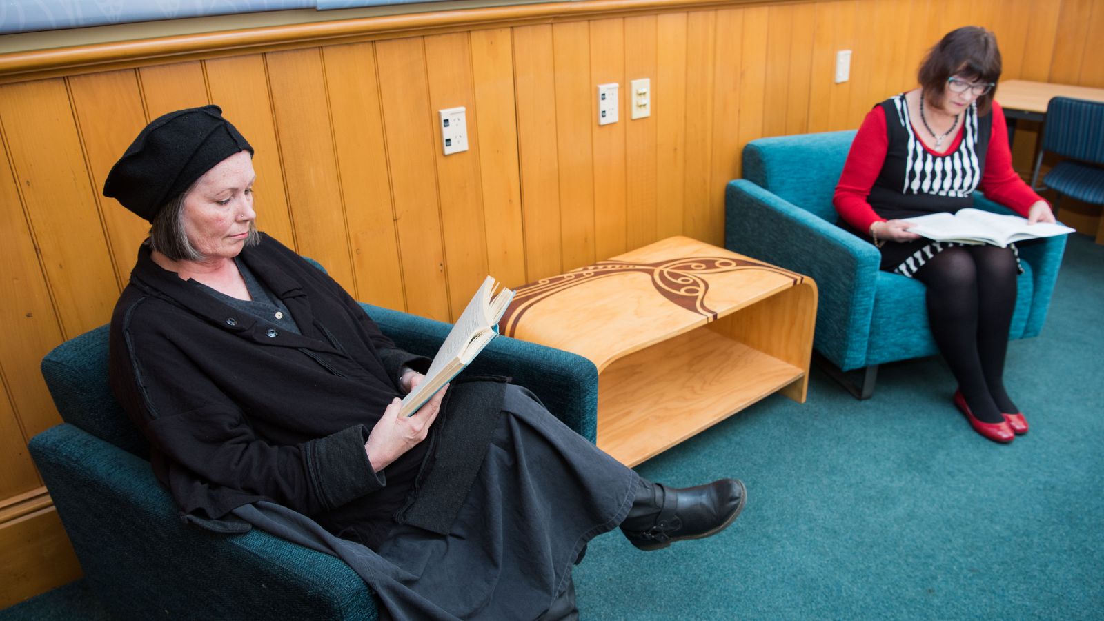 Visitors to the Library sitting comfortably and reading