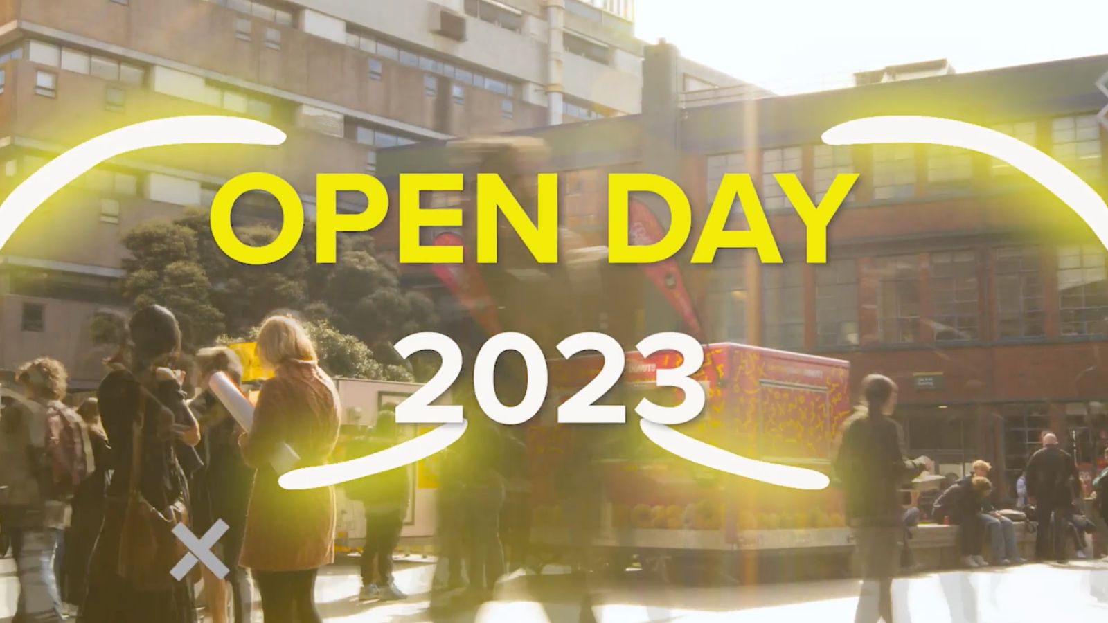 A busy outdoor space on campus with the words Open Day 2023 overlaid