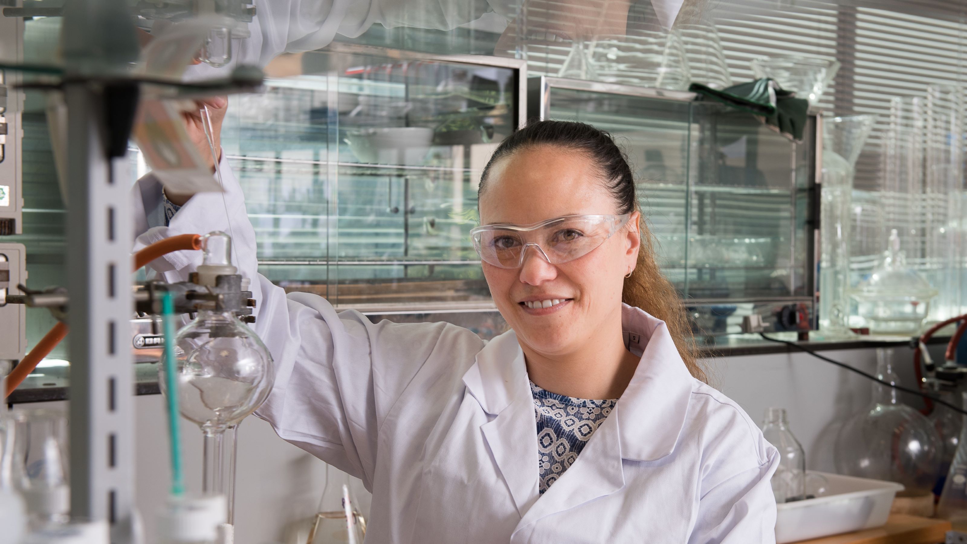 Helen Woolner poses in her lab