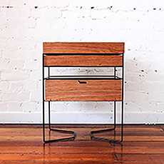 A bed side table made of plywood and wire