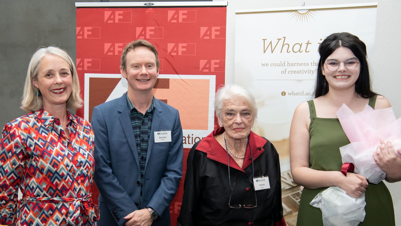 Prize winner with teachers Kate Duignan and Damien Wilkins and sponsor with banners 