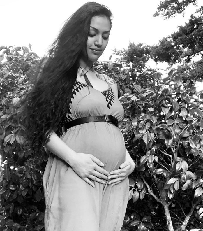 A picture of an ambassador for the Hapu Mama Connecting programme, Harlem Cruz Atarangi Ihaia, who is pregnant in the image