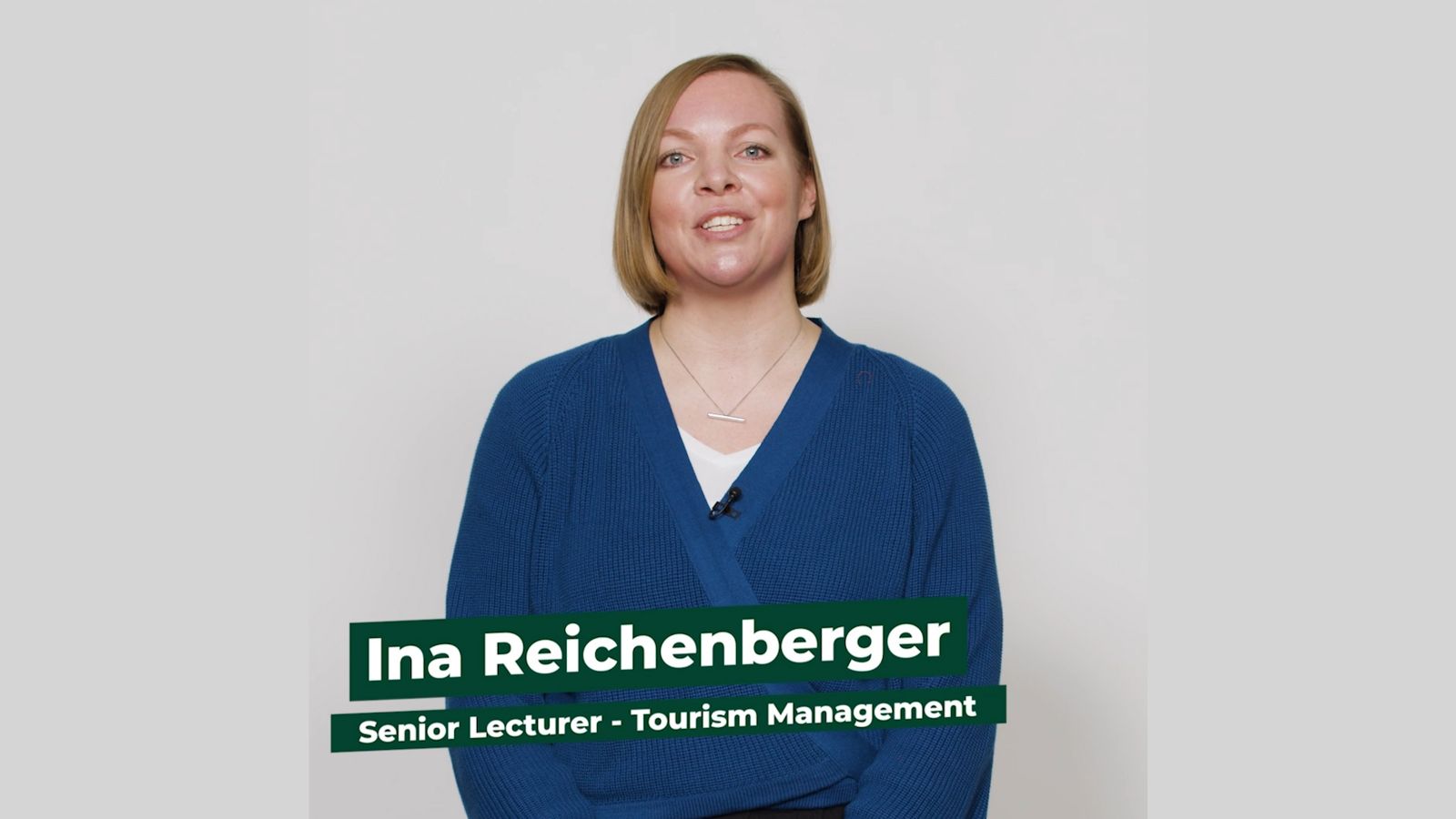 Senior Lecturer Ina Reichenberger stands facing the camera against a white background