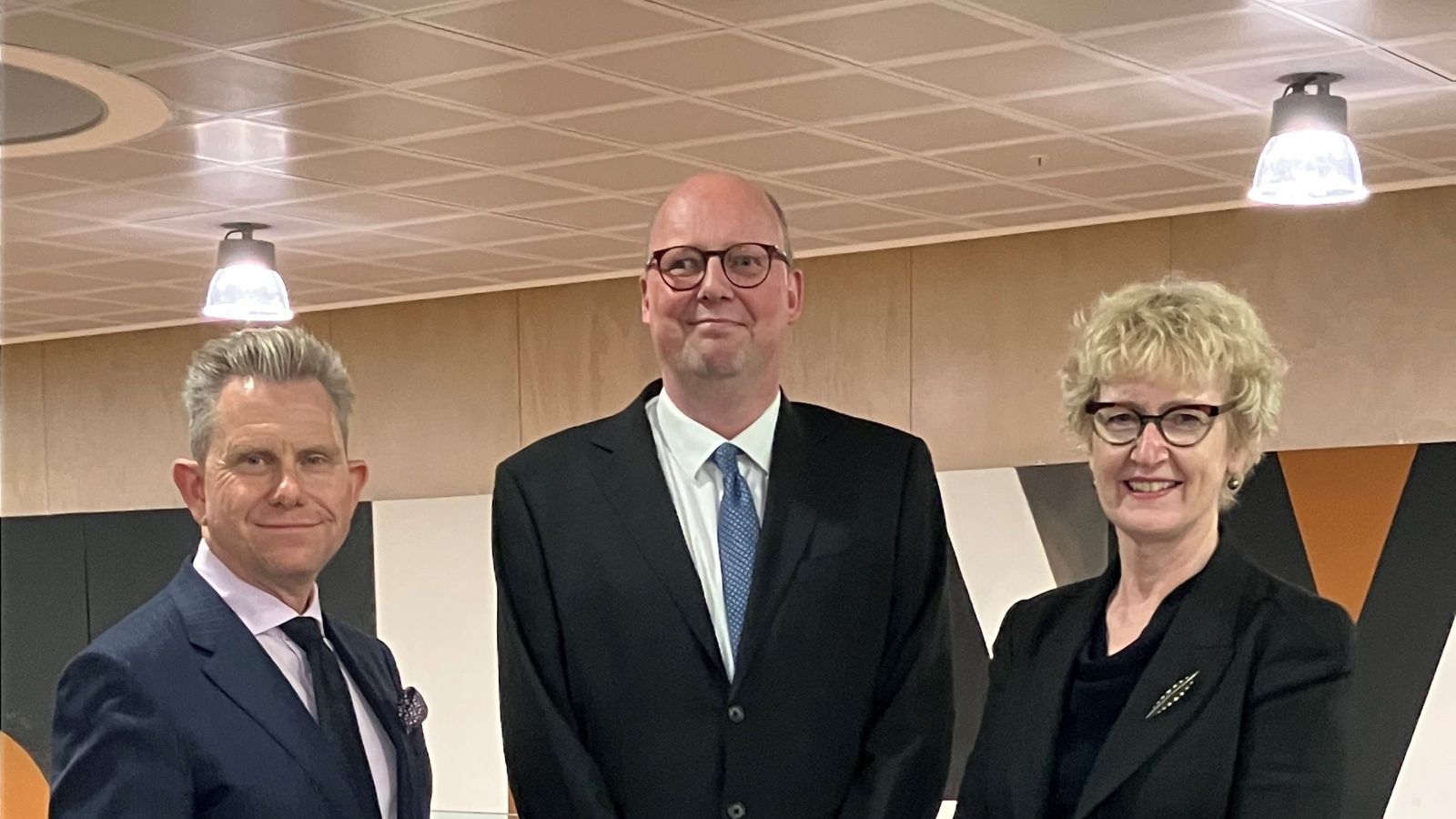 Professor Karl Lofgren, flanked by two other staff members, at his inaugural lecture