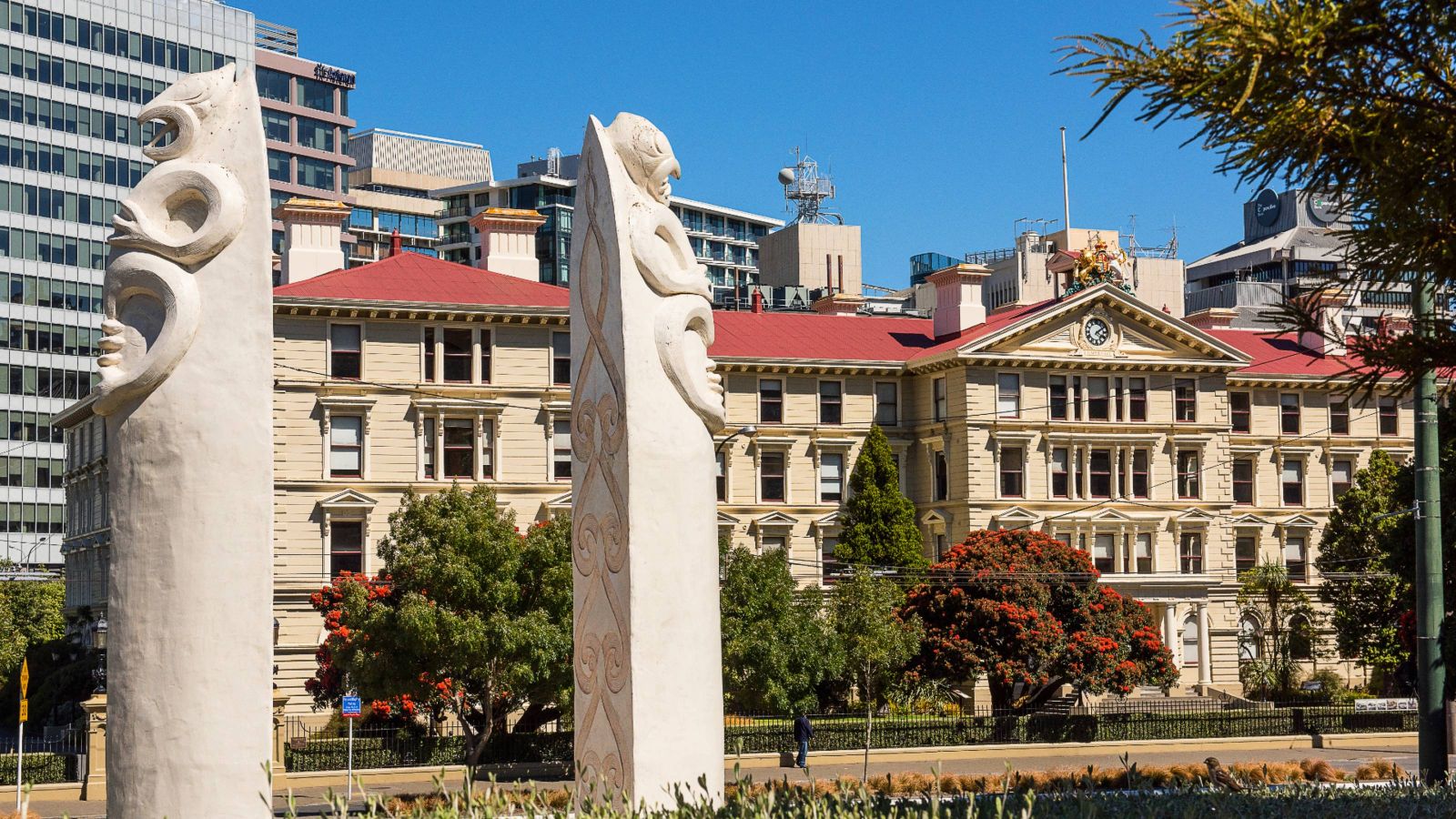 The Law School in the Old Government Buildings seen from across the road with Māori columns in foreground