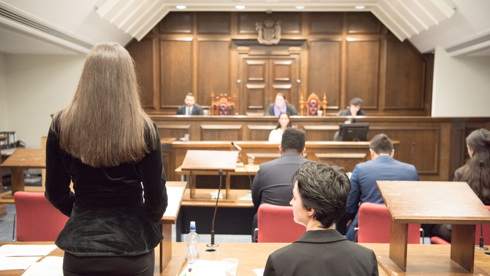 Students are practising mooting in a court room