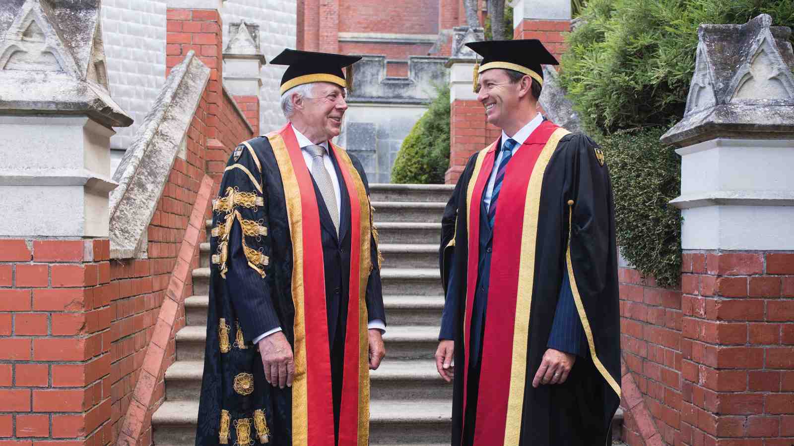 Victoria Chancellor Sir Neville Jordan in graduation dress outside our iconic Hunter Building.