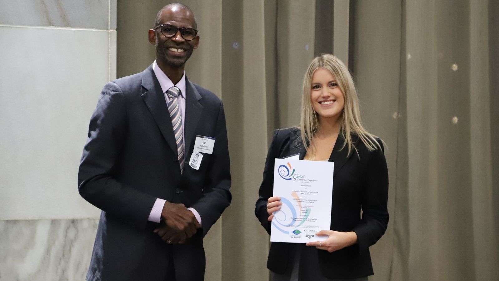 Pro-Vice-Chancellor and Dean of Commerce Professor Ian O Williamson with Bachelor of Commerce student Melanie Davis, who is holding her Champion Team Leader Award