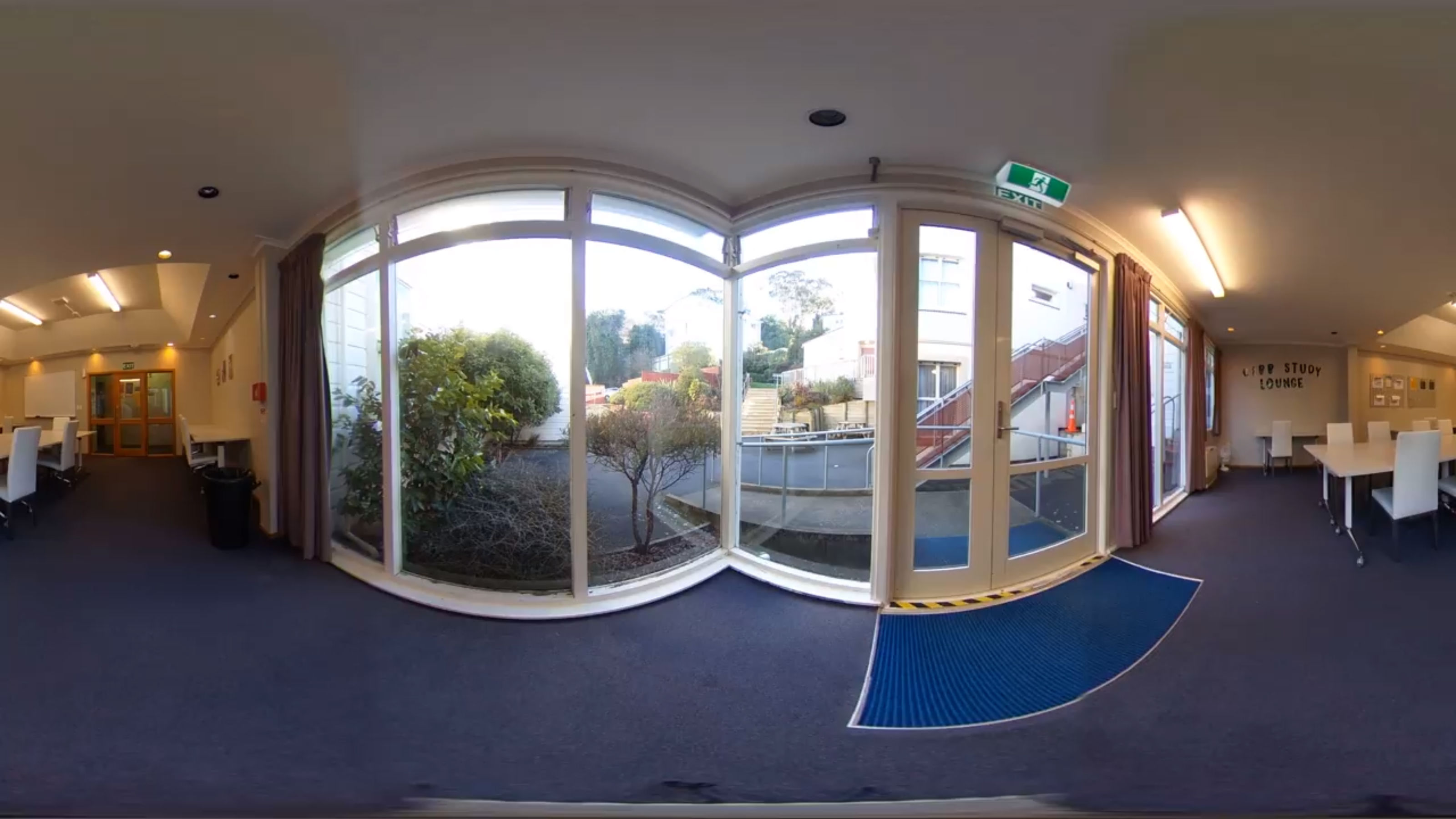 A panoramic image of a common area in Victoria House that also looks out into a courtyard.