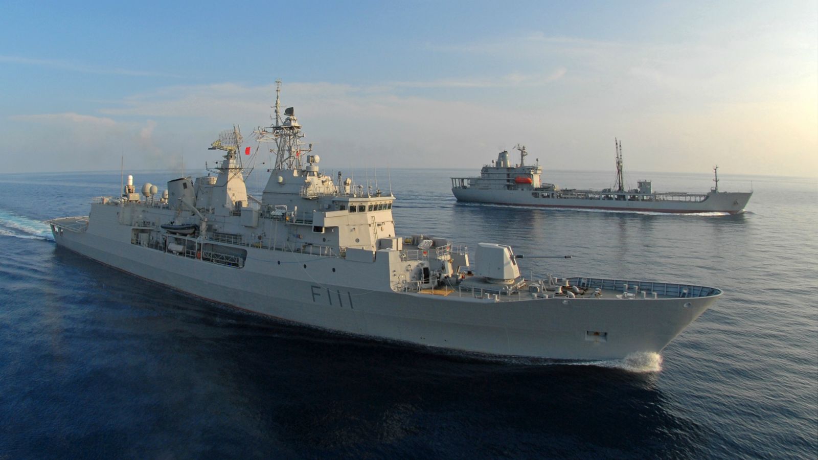 2 NZ Navy ships – Te Mana at sea with HMNZS Endeavour in the background.