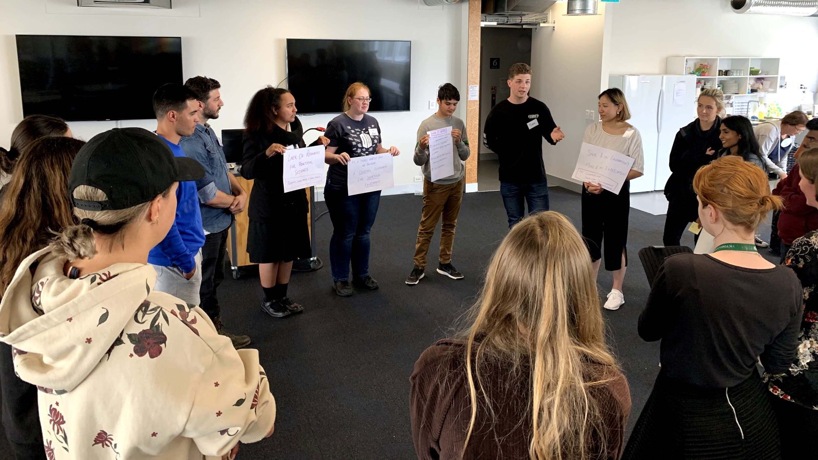 Winning team making their pitch to other participants at the Hackathon.