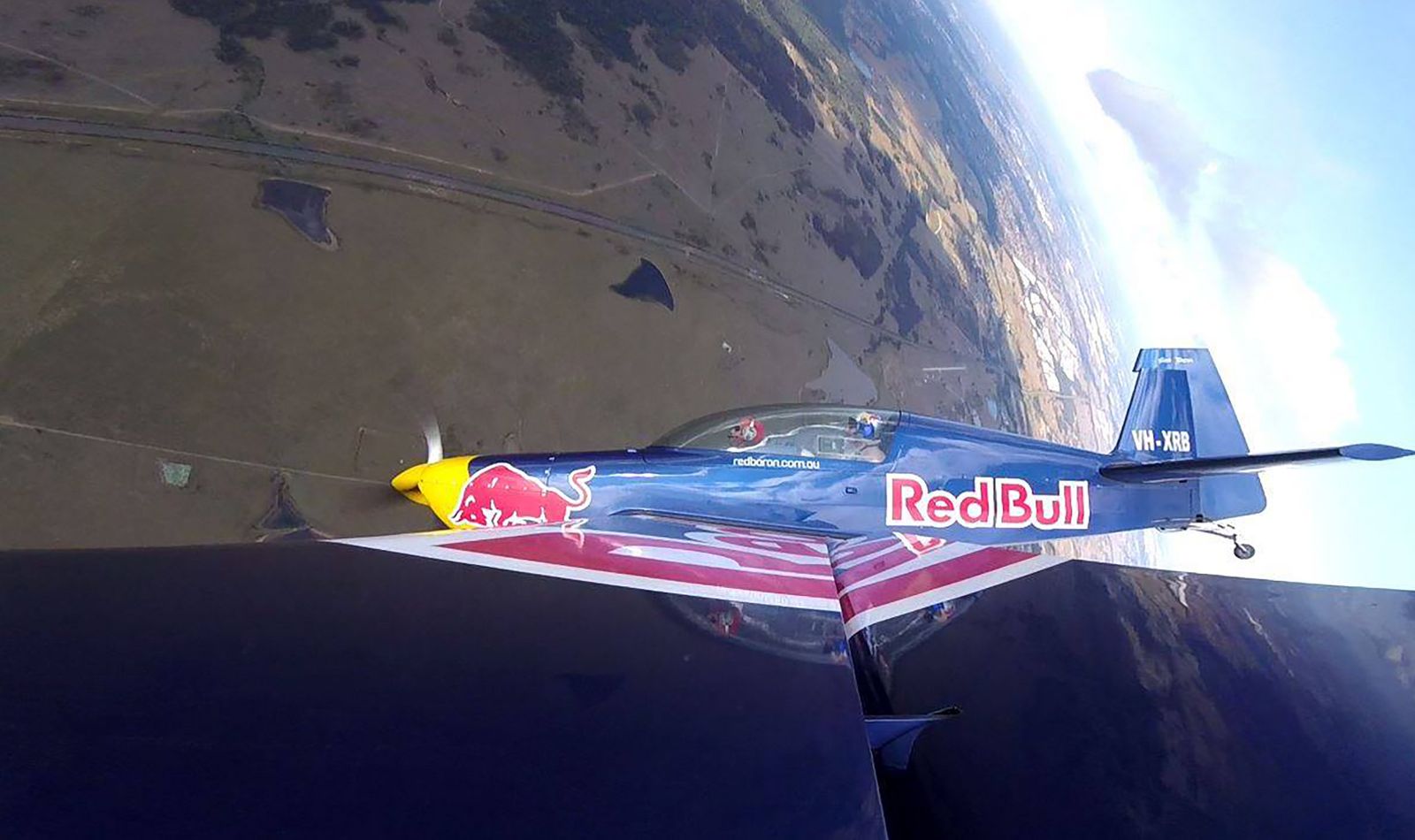 Conrad Reyners flying in a Red Bull stunt plane.
