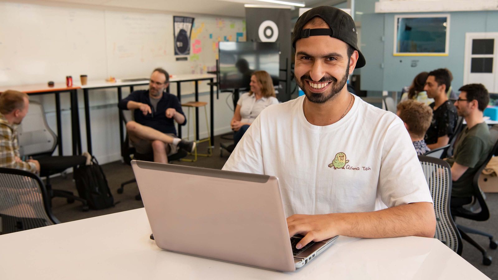 Student Mohammad Al-Rubayee sits at a desk in The Atom—Te Kahu o Te Ao innovation space