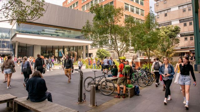 View of Tim Beaglehole courtyard, on Kelburn campus, with students walking