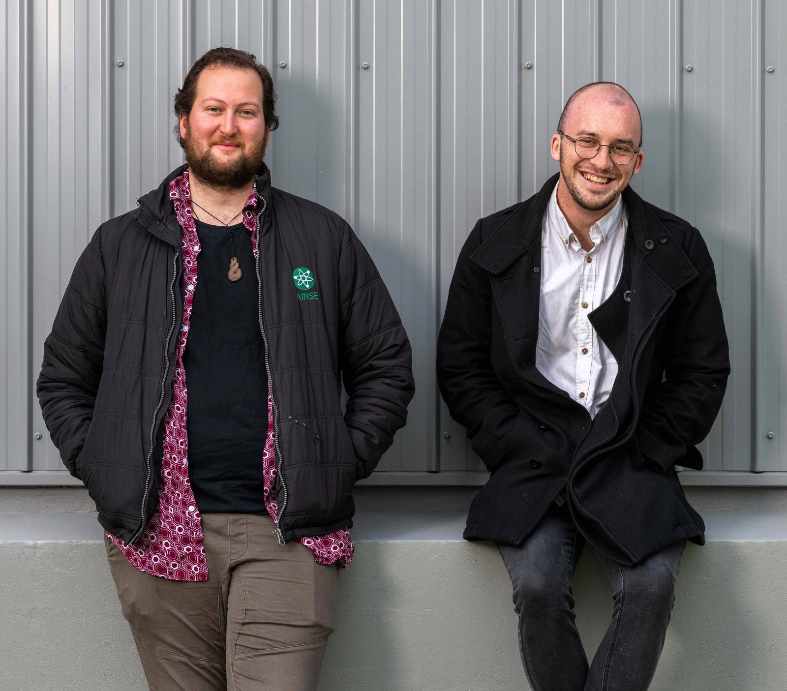 Tane Butler and Gabriel Bioletti leaning on a ledge