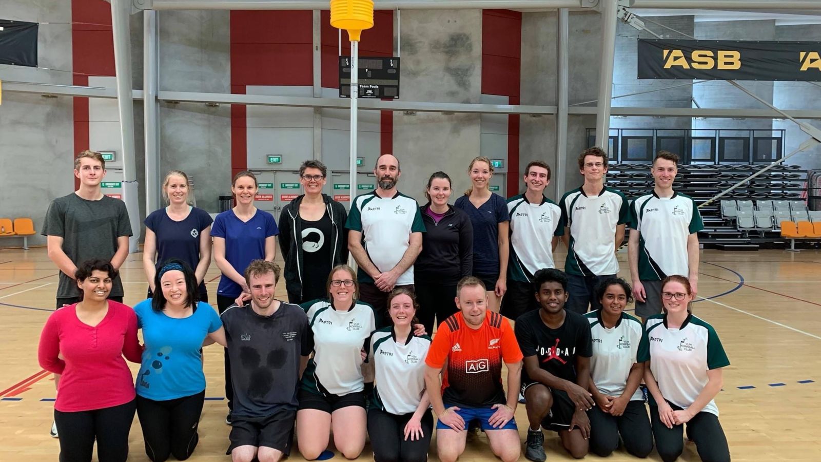 Team picture in sports hall.